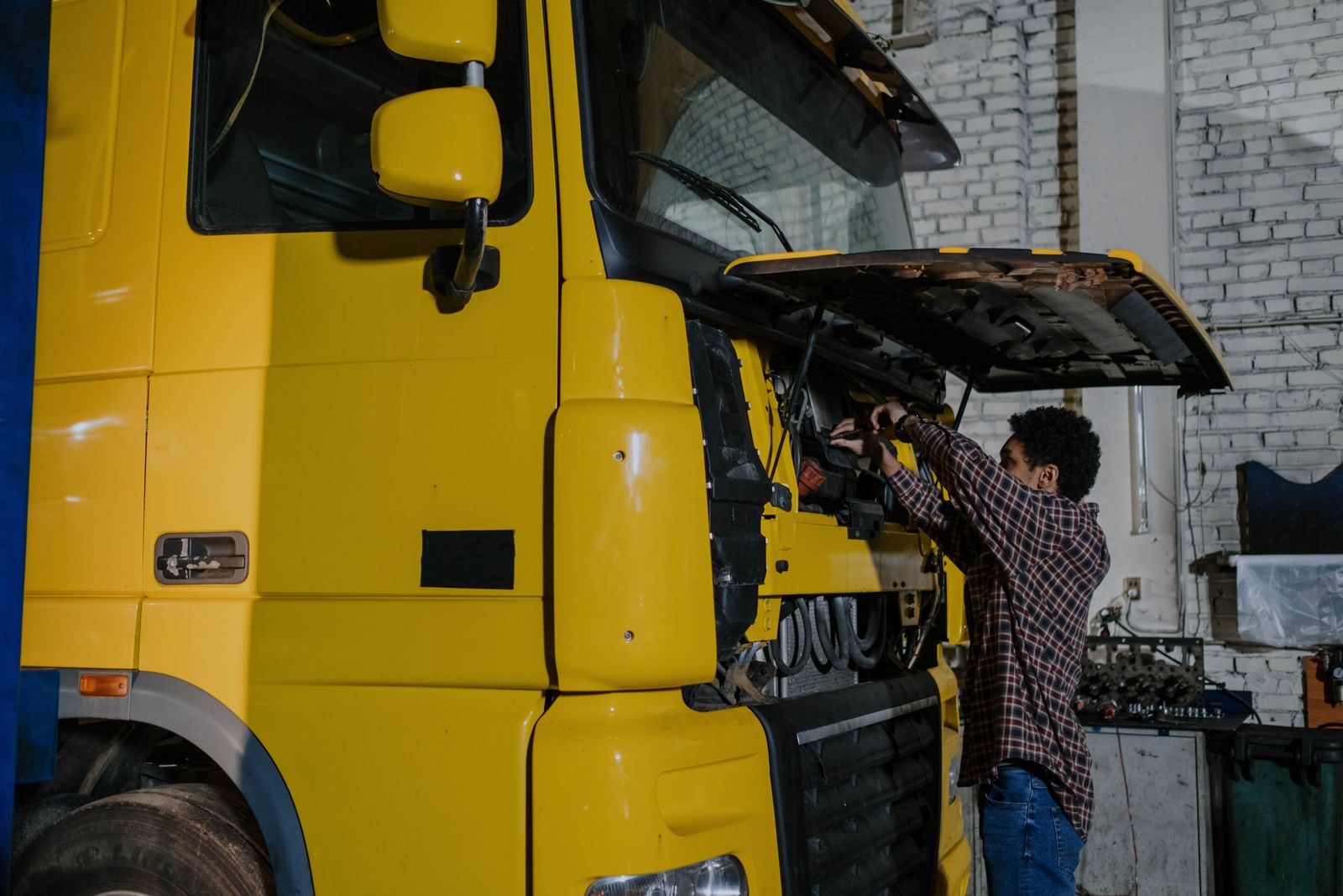 Mechanic working on the air line system of a heavy-duty truck