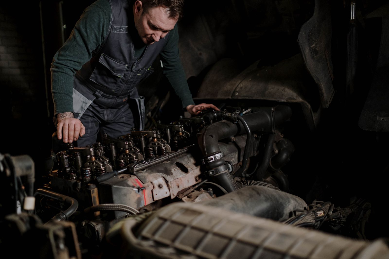 Mechanic repairing a heavy-duty diesel engine